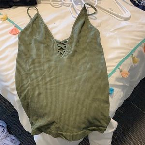 Free people tank top criss cross neck. A little worn,
